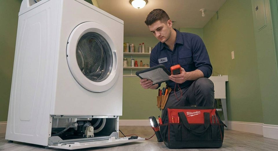 Front-loader with the service panel open — pump and drain inspection